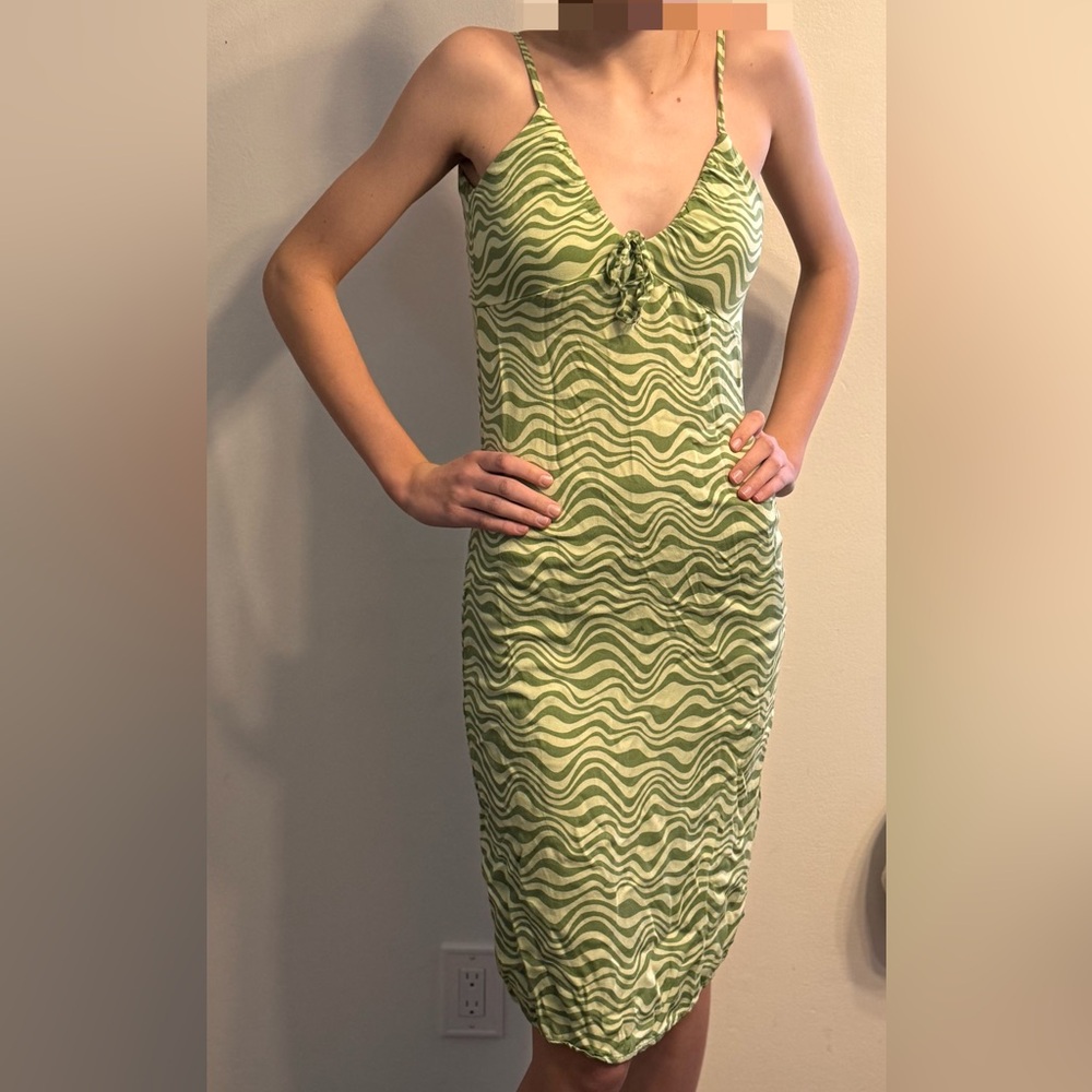 Light weight dress and very stretchy. Light green